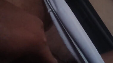 Masturbating